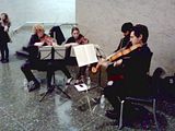 SFGMC, 12.08.2011 String quartet playing in lobby of Masonic Auditorium, before the holiday concert by San Francisco Gay Mens' Chorus.